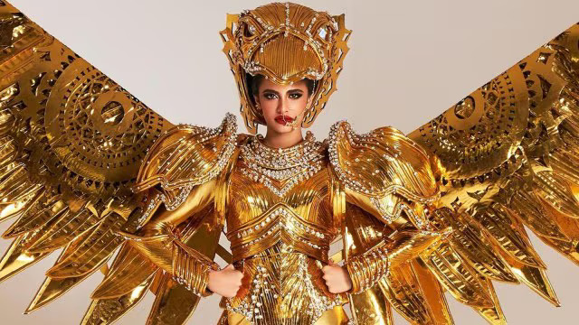 Miss Universe 2024 contestant Rhea Singha performs as a golden bird in a national costume round